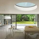Round rooflight above bifold doors