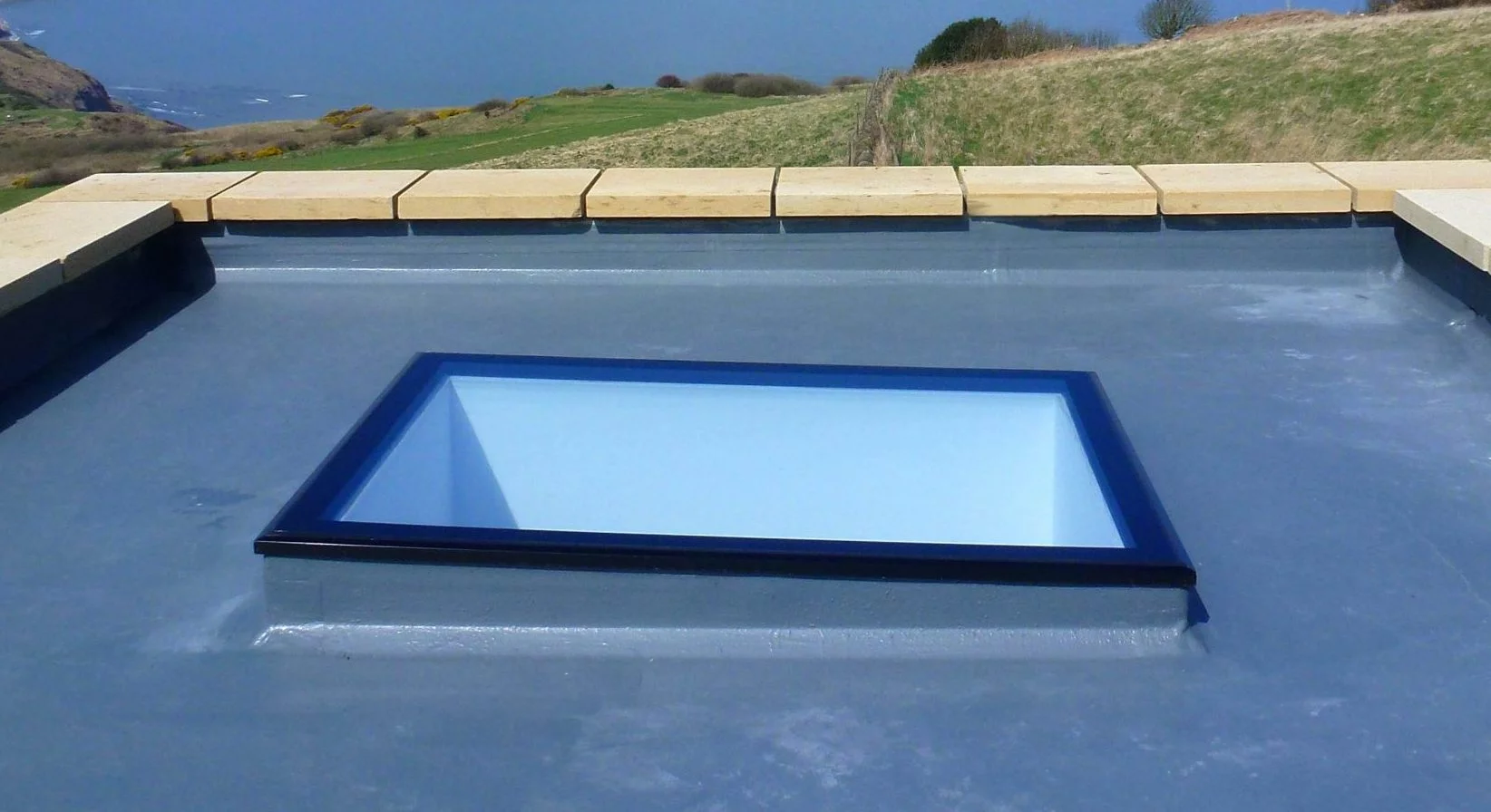 Fixed flat rooflght and cliff top views