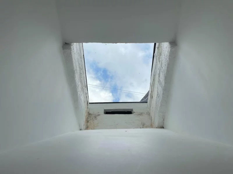 View up old coal shute to rooflight