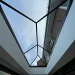 Looking up through roof lantern cloudy sky