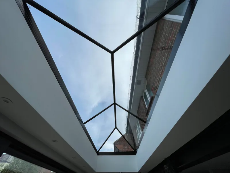 Looking up through roof lantern cloudy sky
