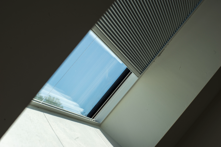 Pitche rooflight with half closed blind