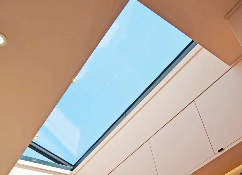 Hinged opening flat roof window