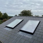 Two pitched rooflights on tiled roof