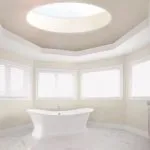 Round rooflight in roof above bath