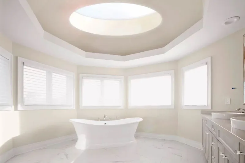 Round rooflight in roof above bath