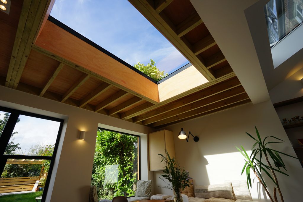 Flat rooflight installed in exposed wooden ceiling
