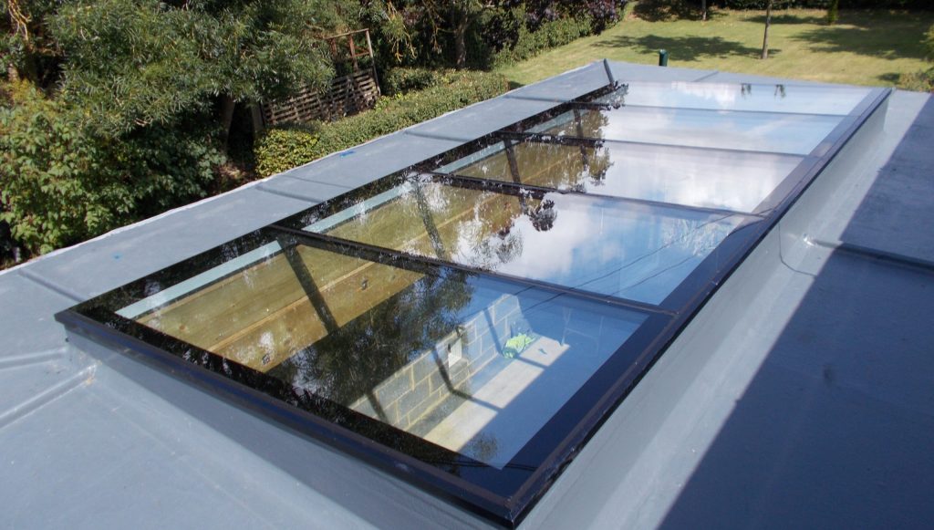 Long modular rooflight installed on flat roof