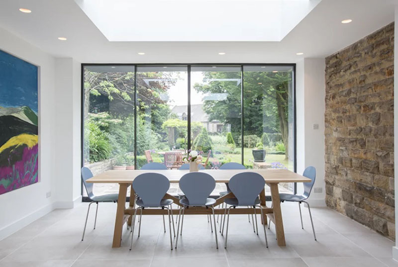 Light from rooflight above sliding doors and dining area